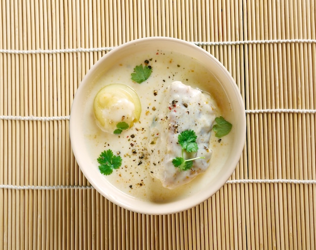 Turkish Tangy Fish Soup on bamboo surface