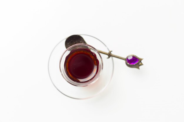 Turkish tea in traditional glass isolated on white background