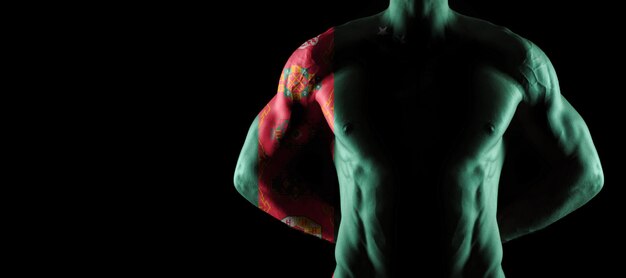 Turkmenistan flag on muscled male torso with abs, black background