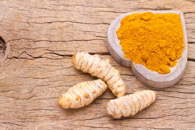 Turmeric in bowl on table top view