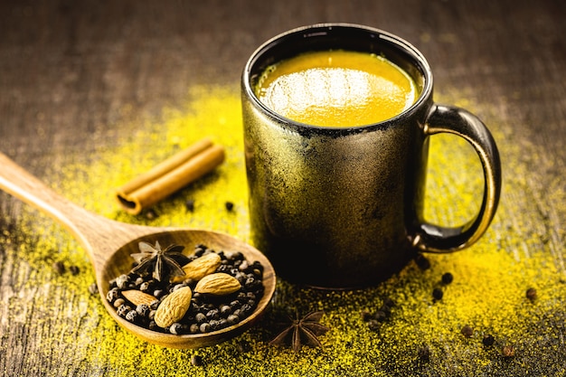 Photo turmeric and cinnamon milk, golden milk, ancient indian drink