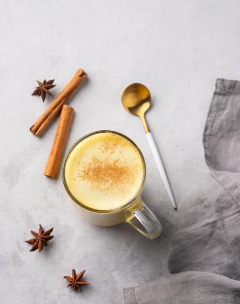 Turmeric golden milk latte with spices and honey Detox immunity boosting antiinflammatory healthy cozy drink