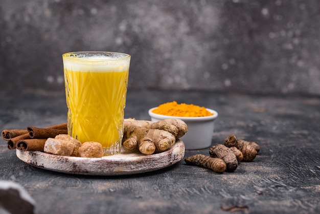 Turmeric golden milk with cinnamon and ginger. Healthy drink