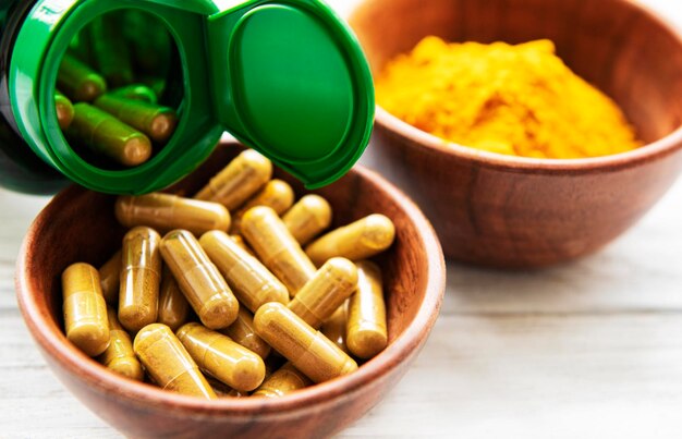 Photo turmeric powder and capsules