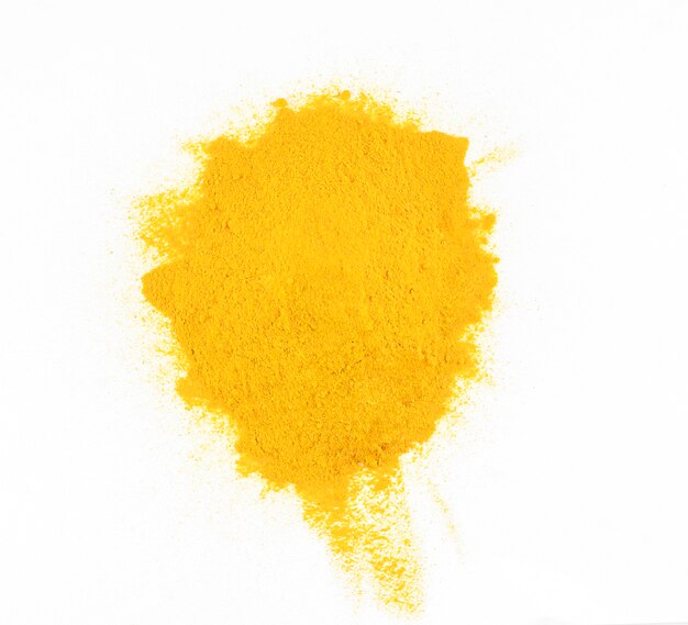 Turmeric powder isolated on the white background, top view. High quality photo