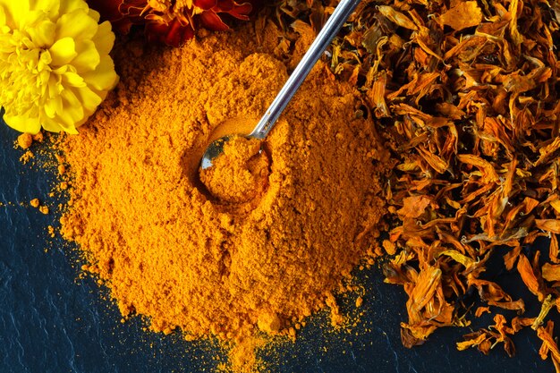 Turmeric powder over slate background