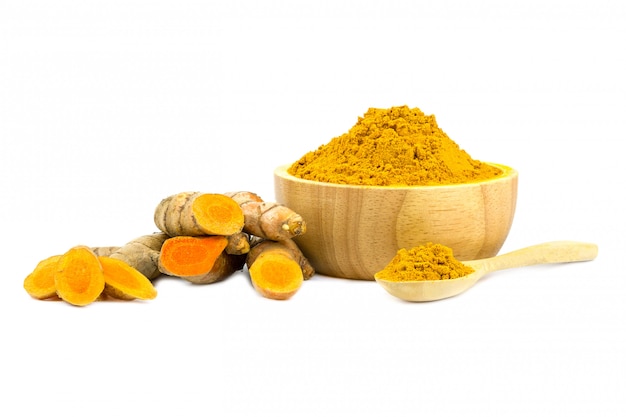 Turmeric powder and turmeric isolated on white 