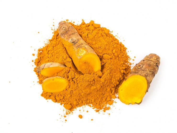 Photo turmeric powder on white background, herbs