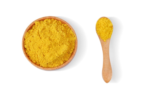 Turmeric powder with wooden bowl and wooden spoon isolated on white background,Top view