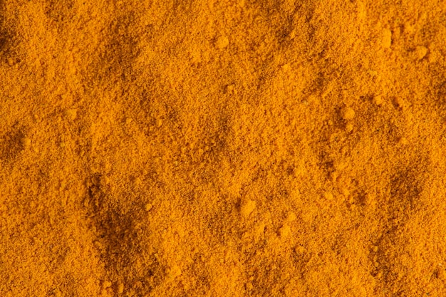 Turmeric spice background on macrophotography