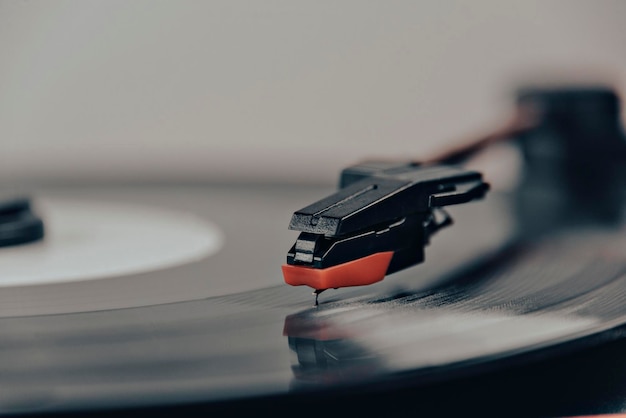 Turntable plays a vinyl record black platter