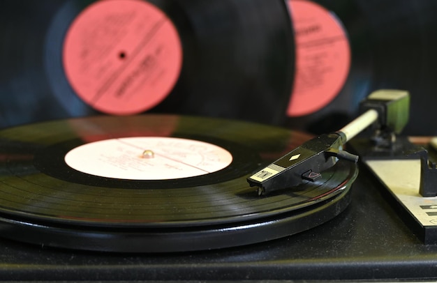 Turntable with old vinyl records with recordings of artists of yesteryear