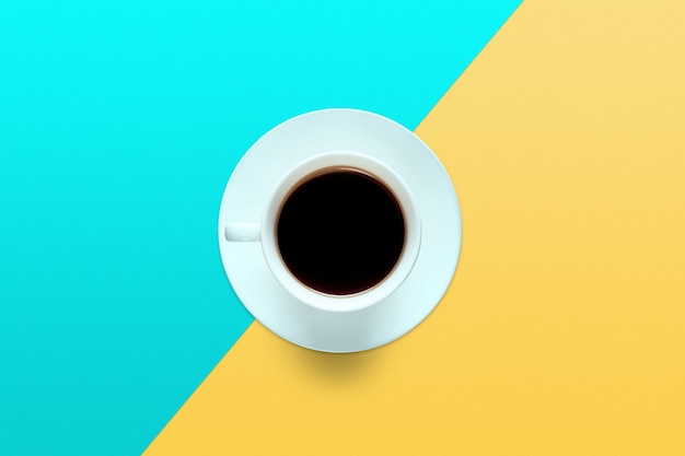 Photo turquoise cup of coffee on a background of turquoise and yellow color