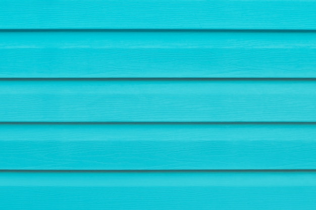 Turquoise fence. Painted wood with lines.