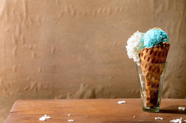 Turquoise ice cream in waffle cone