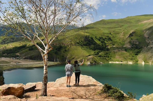 Turquoise lake Gizhgit in the village Bylym