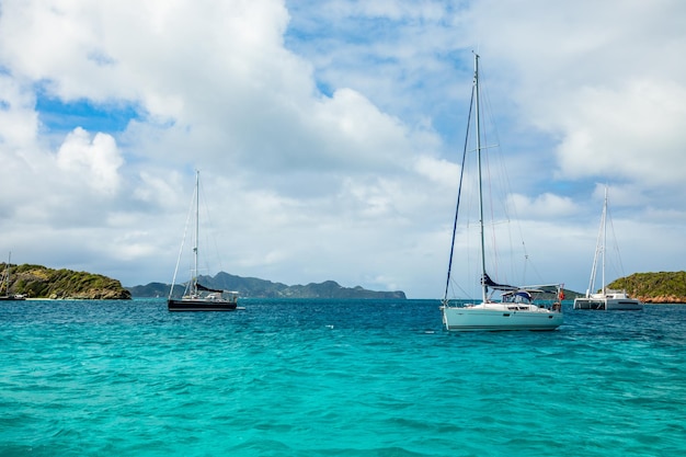 Turquoise sea and anchored yachts and catamarans Tobago Cays Saint Vincent and the Grenadines Caribbean sea