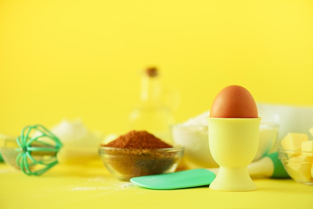 Turquoise and yellow cooking utensils on bright background. food ingredients. cooking cakes and baking bread concept