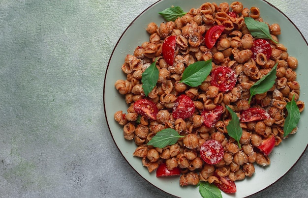 Tuscan pasta with smoked paprika and basilparmesan cheese Italian traditional cuisine