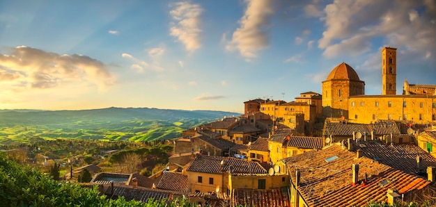 Tuscany Volterra town skyline church and panoramic view at sunset Italy