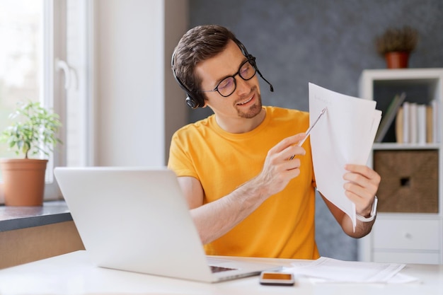 Tutor giving online class via video call on laptop