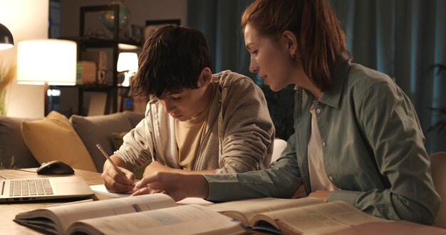 Photo tutor helping a student with his homework