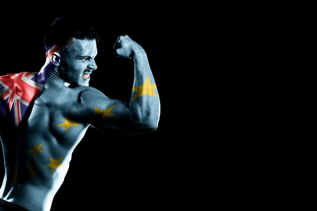 Tuvalu flag on handsome young muscular man black background