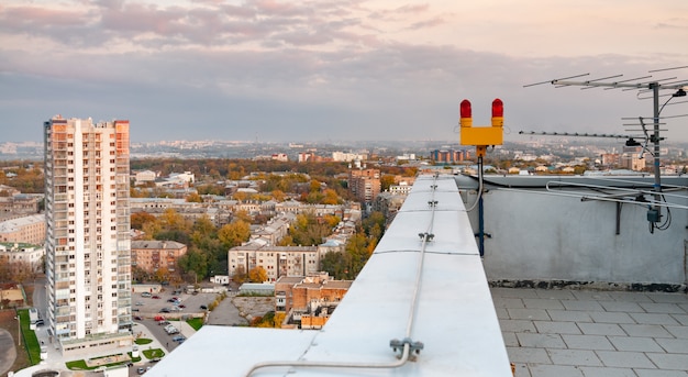 TV antenna on the roof of a multi-story building