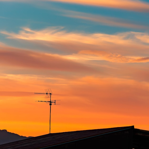 Tv antenna at sunset