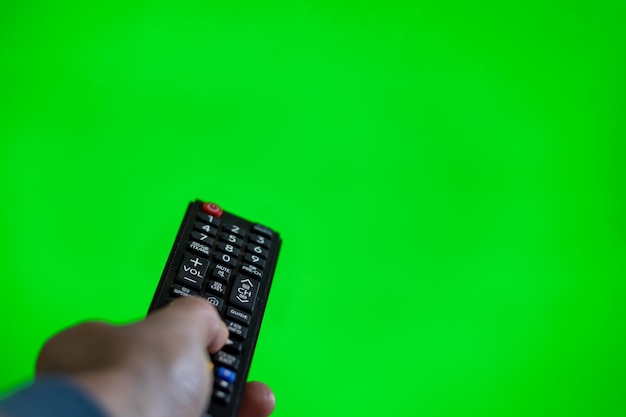 TV remote control on green chroma screen