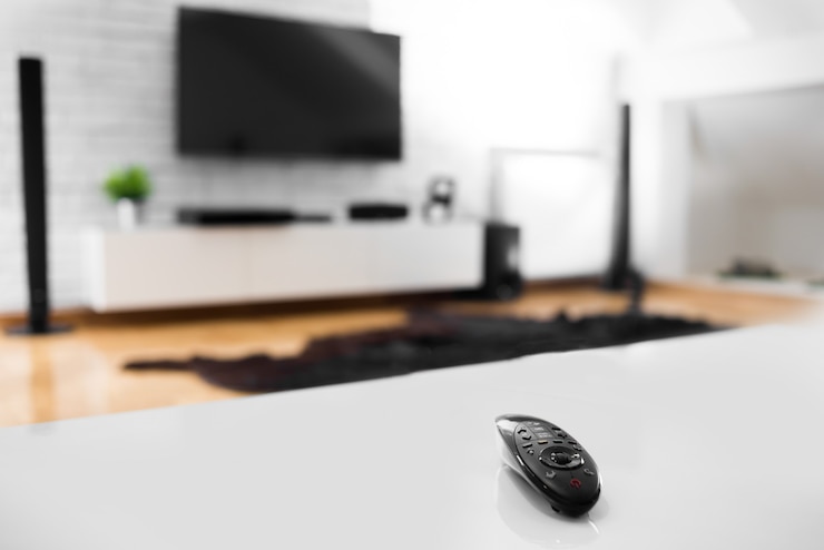 TV remote on a white table