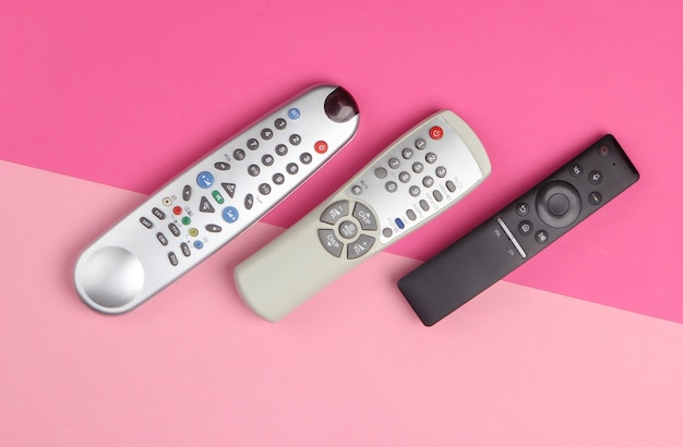 Tv remotes on pink pastel