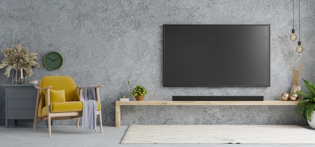 TV room interior with yellow armchair in loft style house on concrete wall background