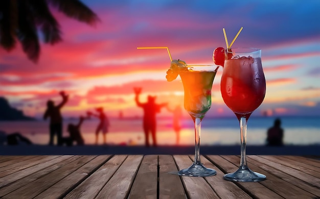 Twee cocktails met blur strand oceaan feest en kleurrijke zonsondergang hemel in de achtergrond luxe