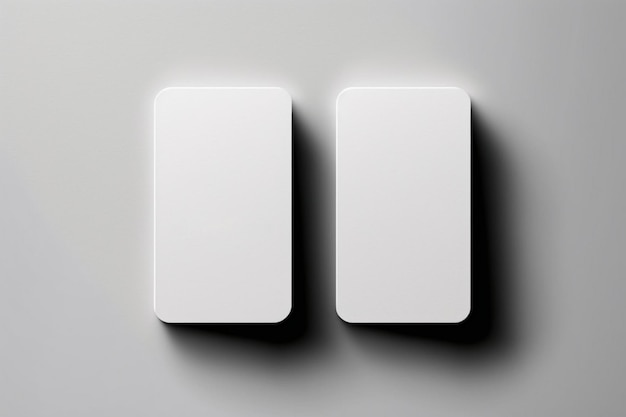 Twee witte vierkante objecten worden weergegeven tegen een grijze achtergrond.