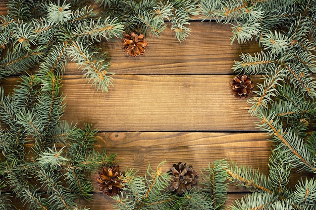 Twijgen van sparren op een houten achtergrond, Kerstmis achtergrond