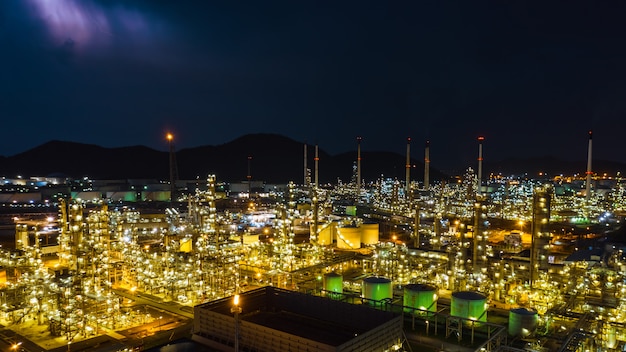 Photo twilight cityscape zone refinery industry factory and storage tank aerial view thailand