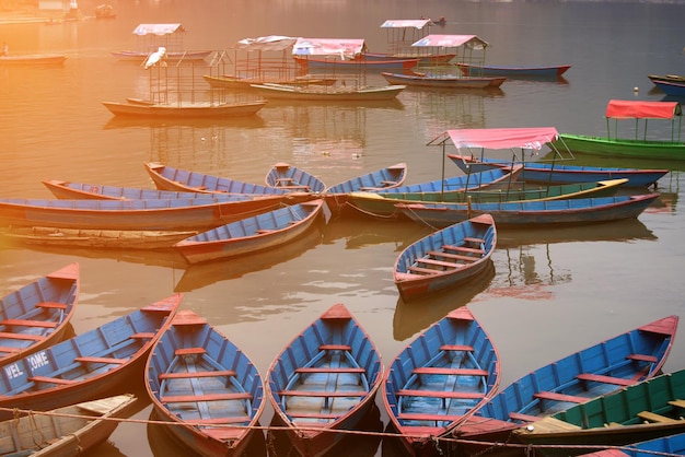 Twilight with boats on Phewa lake Pokhara Nepal