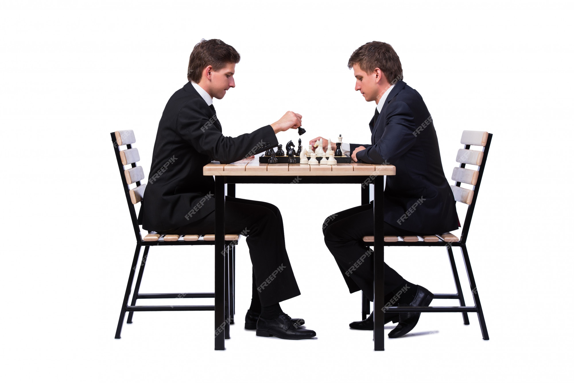 Premium Photo  Twin brothers playing chess isolated on white