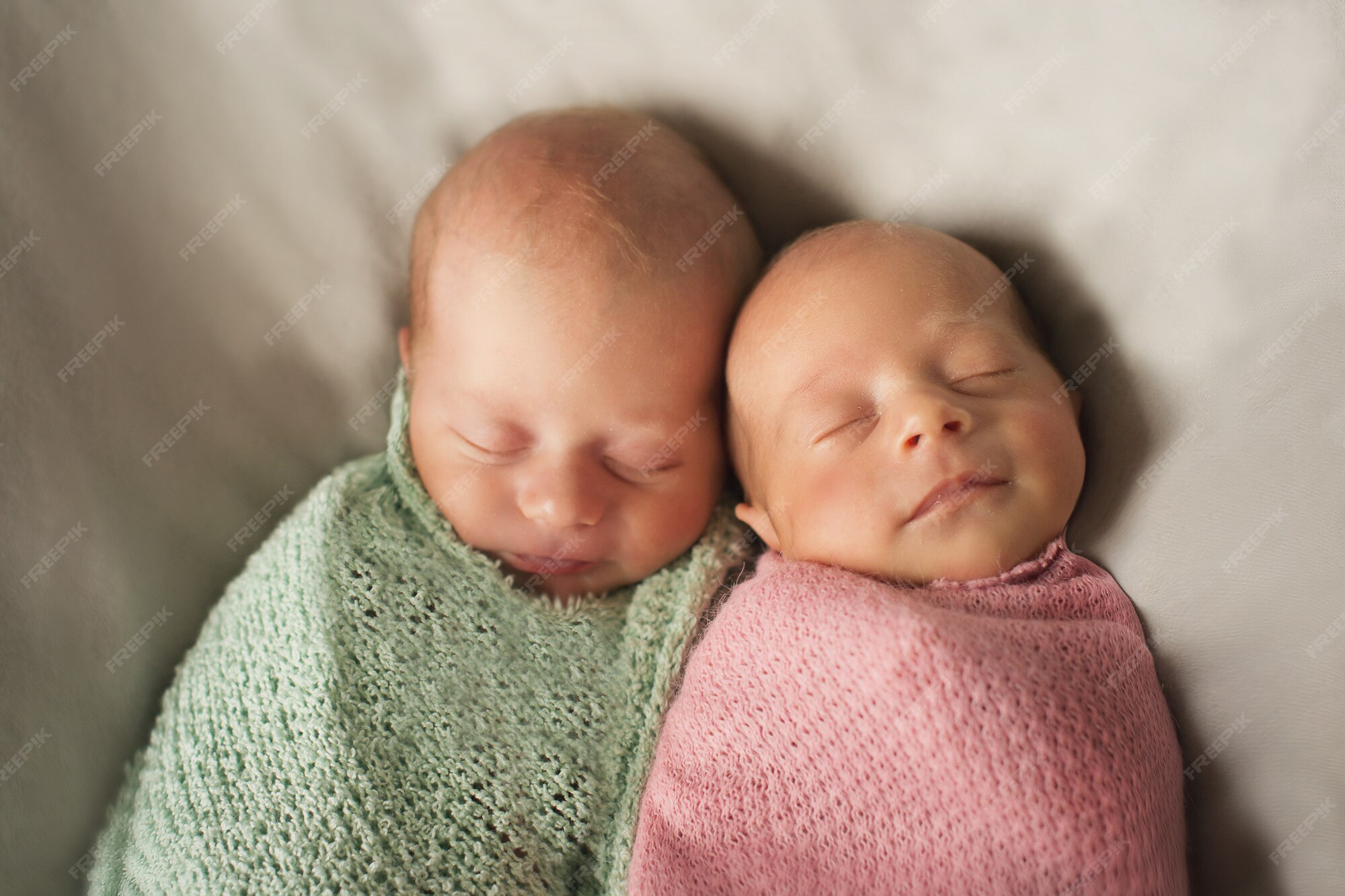 Premium Photo | Twins embrace. newborn babies sleep together