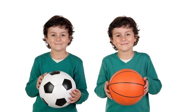 Twins holding a sport balls