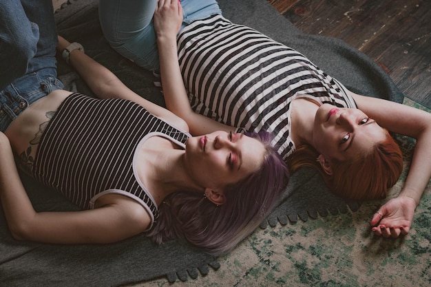 Twins in striped tshirts lie