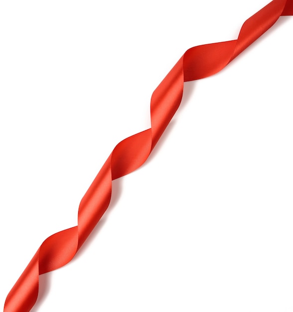 Twisted red silk ribbon isolated on white background, close up