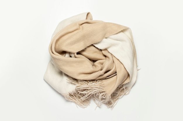 Twisted woolen scarf on a white background.