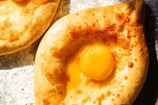 Two Adjarian khachapuri in traditional classic Georgian style