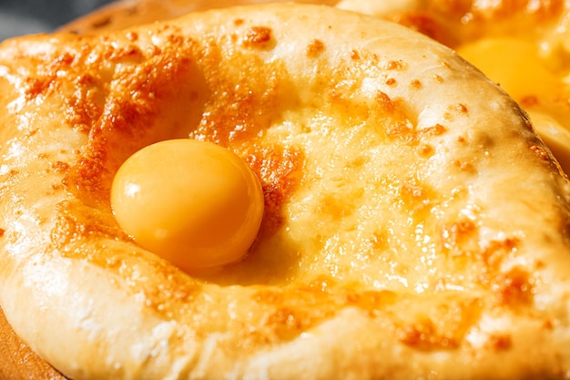 Two Adjarian khachapuri in traditional classic Georgian style