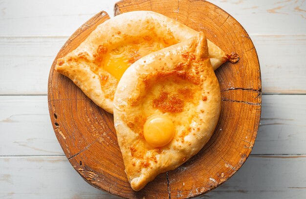 Two Adjarian khachapuri in traditional classic Georgian style