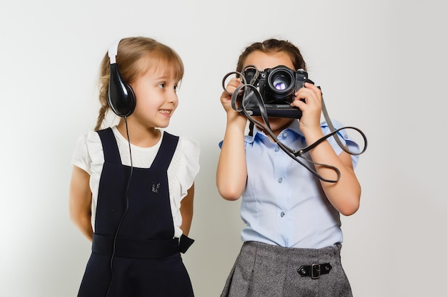 Two adorable little schoolgirls for a break