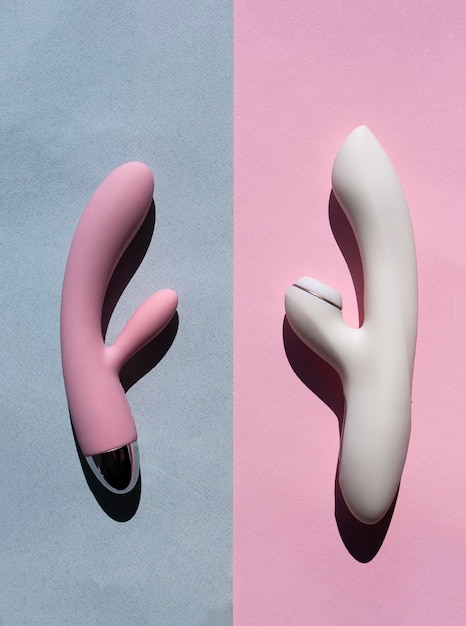 Two adult sex toys in white and pink lie on two different backgrounds