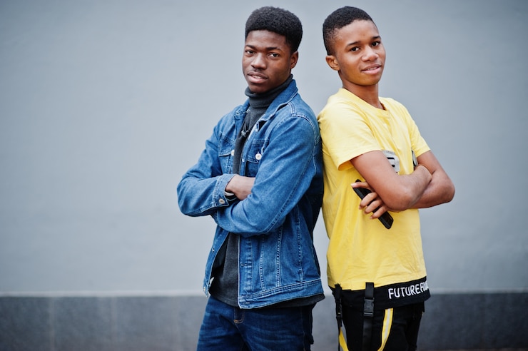 Photo two african male friends talking together.
